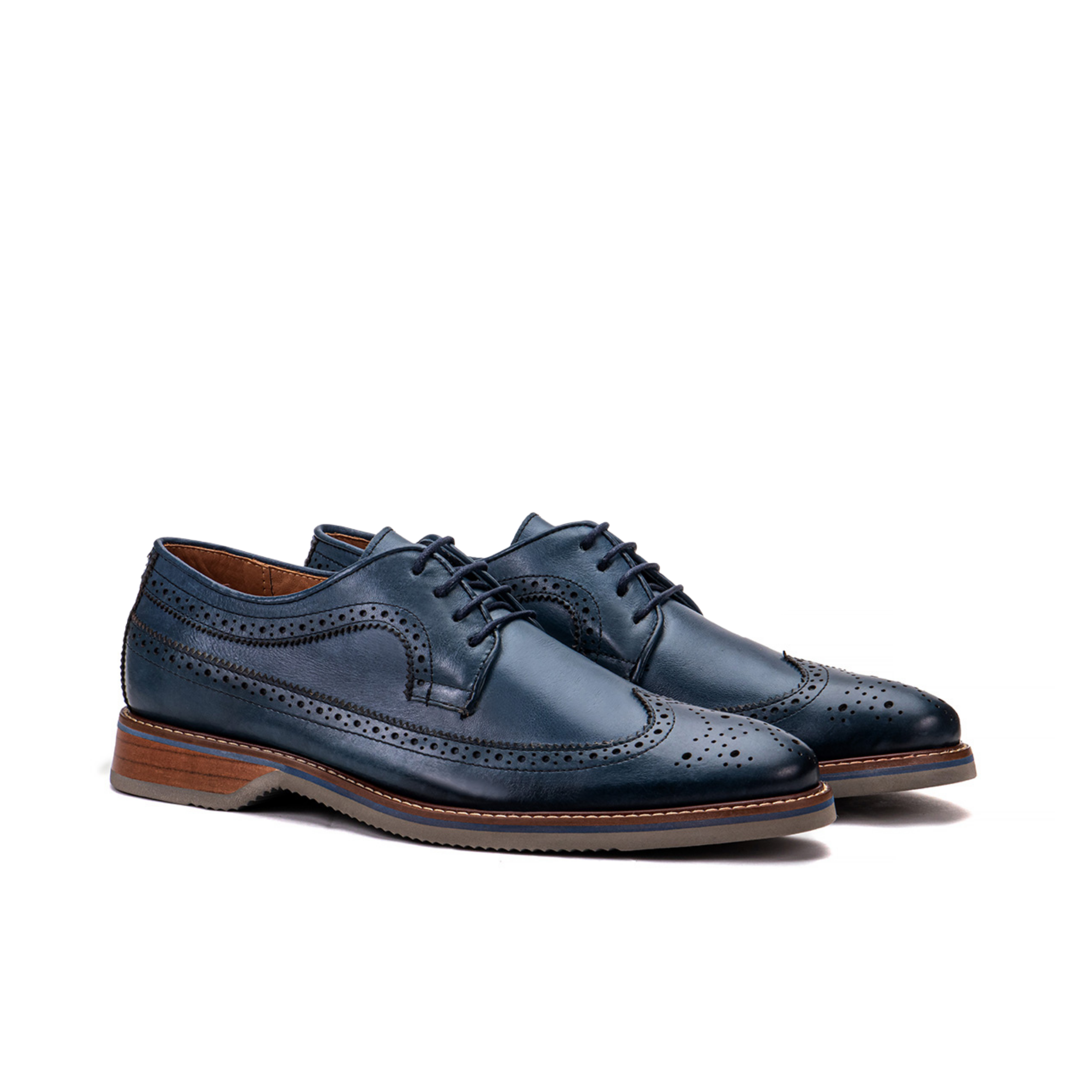 Front angle of The Brasilia blue leather wingtip brogue derby with layered sole detail