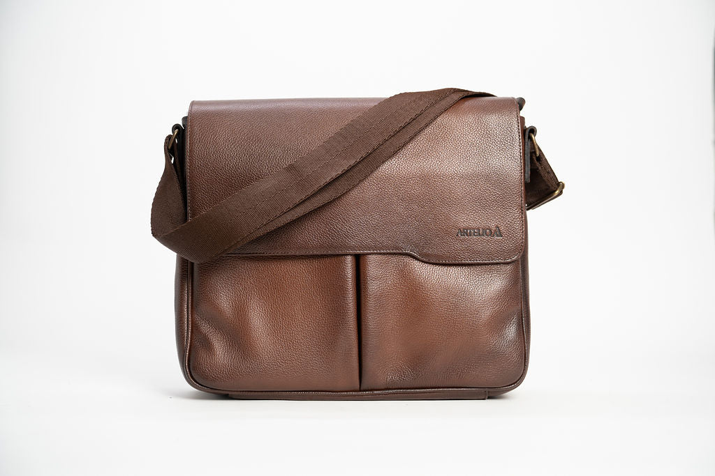 Front view of the Artelio brown leather crossbody bag with flap closure dual front pockets and shoulder strap