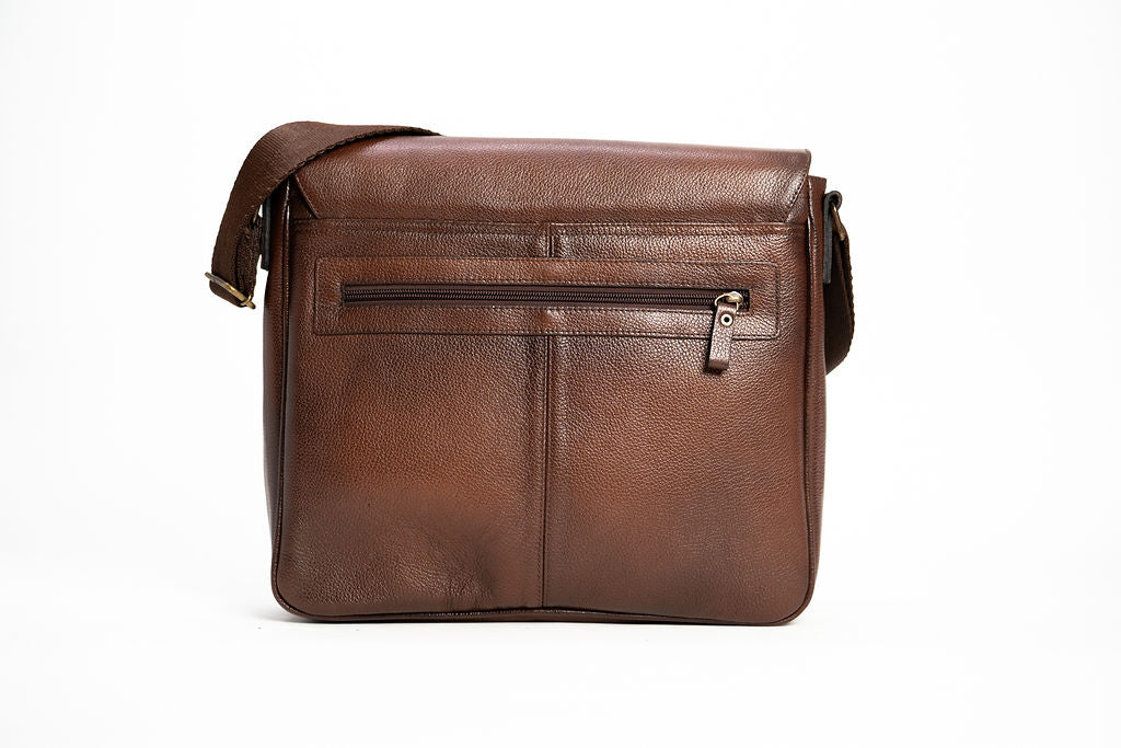 Rear view of the Artelio brown leather crossbody bag with exterior zippered pocket and shoulder strap