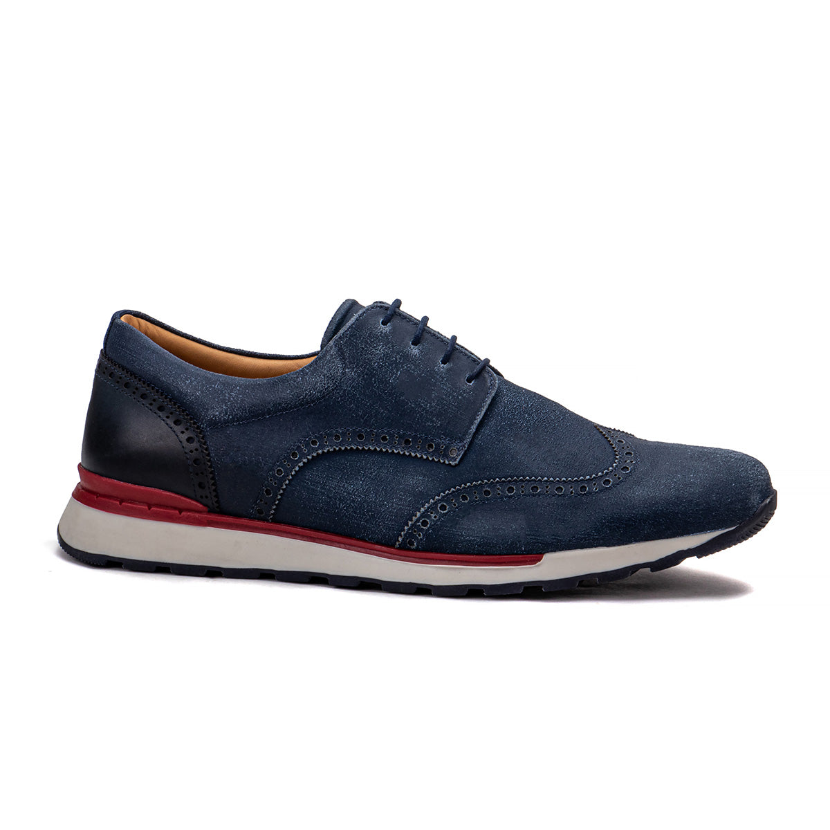 Side profile of the Artelio Neapolitan navy leather wingtip brogue shoe showing the leather upper and flexible sole