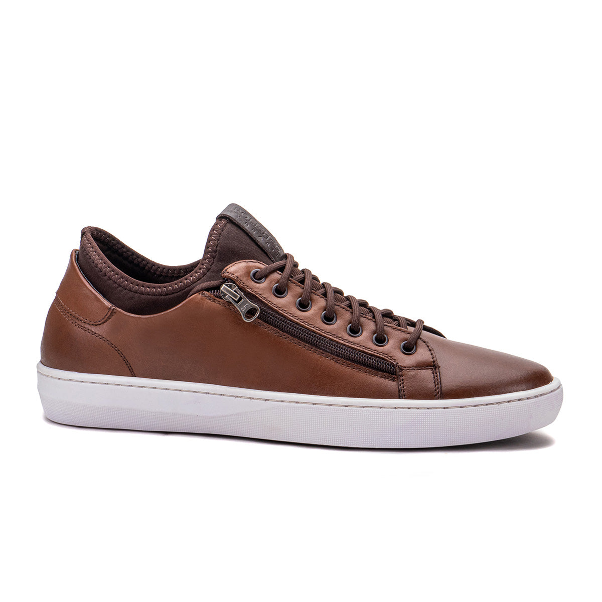 Side profile of the Artelio Pikes Peak tobacco leather side-zip sneaker showing the leather upper and side zipper