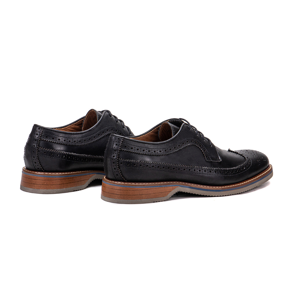 Rear angle of The Brasilia black leather wingtip brogue derby showing heel and layered sole detail
