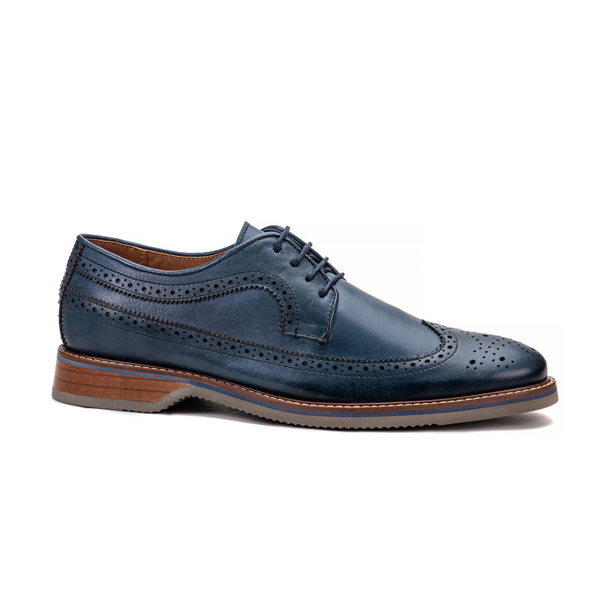 Side profile of The Brasilia blue leather wingtip brogue derby with layered sole and hand-stitched welt detail
