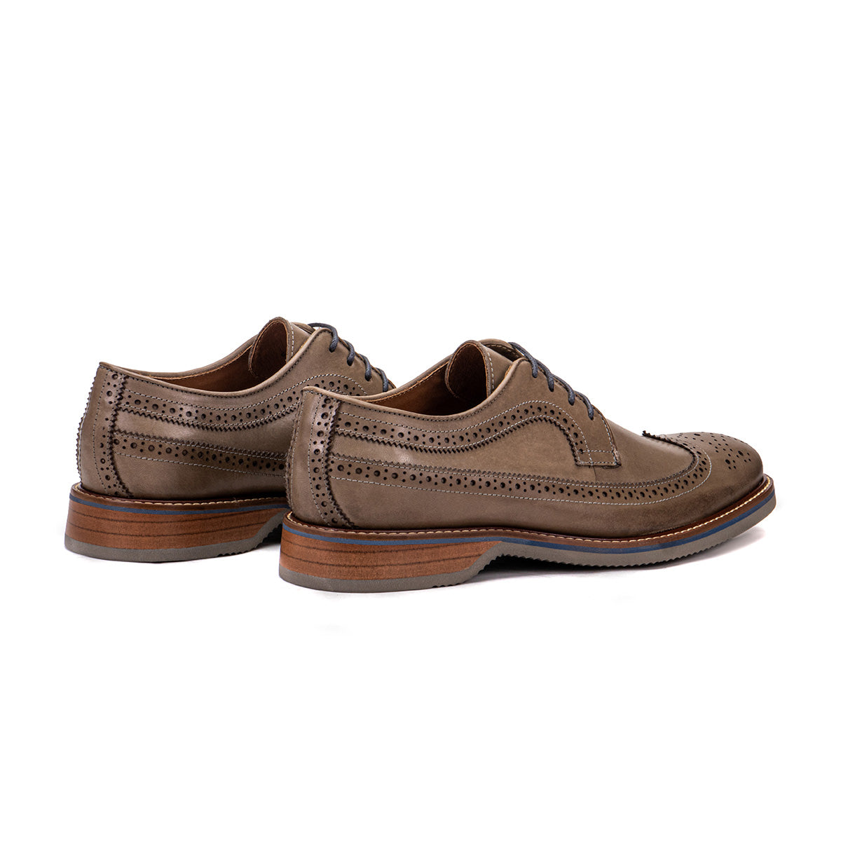 Rear angle of The Brasilia foggy gray leather wingtip brogue derby showing heel and layered sole detail
