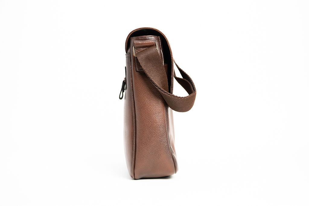 Alternate side profile of the Artelio brown leather crossbody bag showing its narrow depth