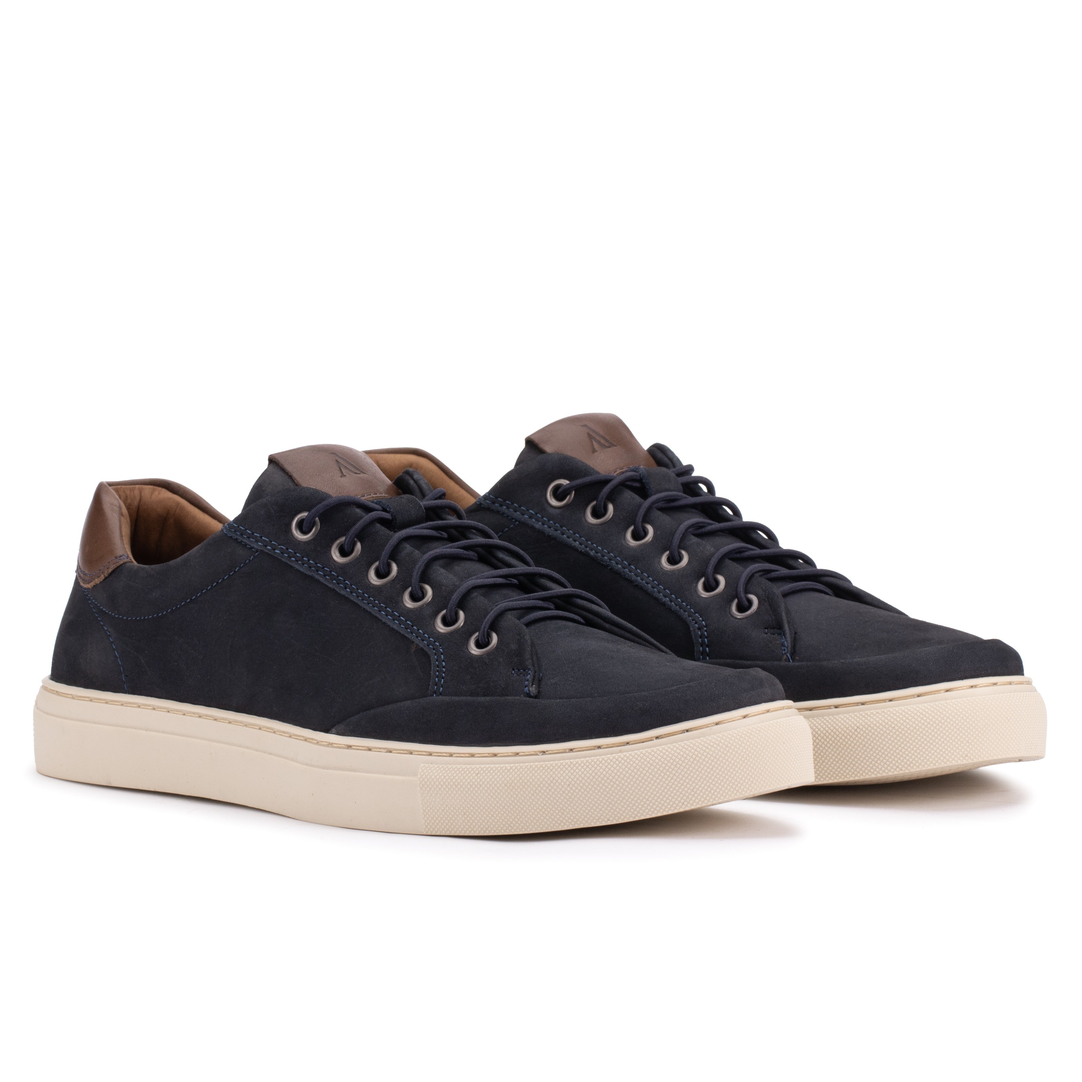 Front angle of the Artelio Elasticore navy nubuck sneaker with elastic laces and a white sole