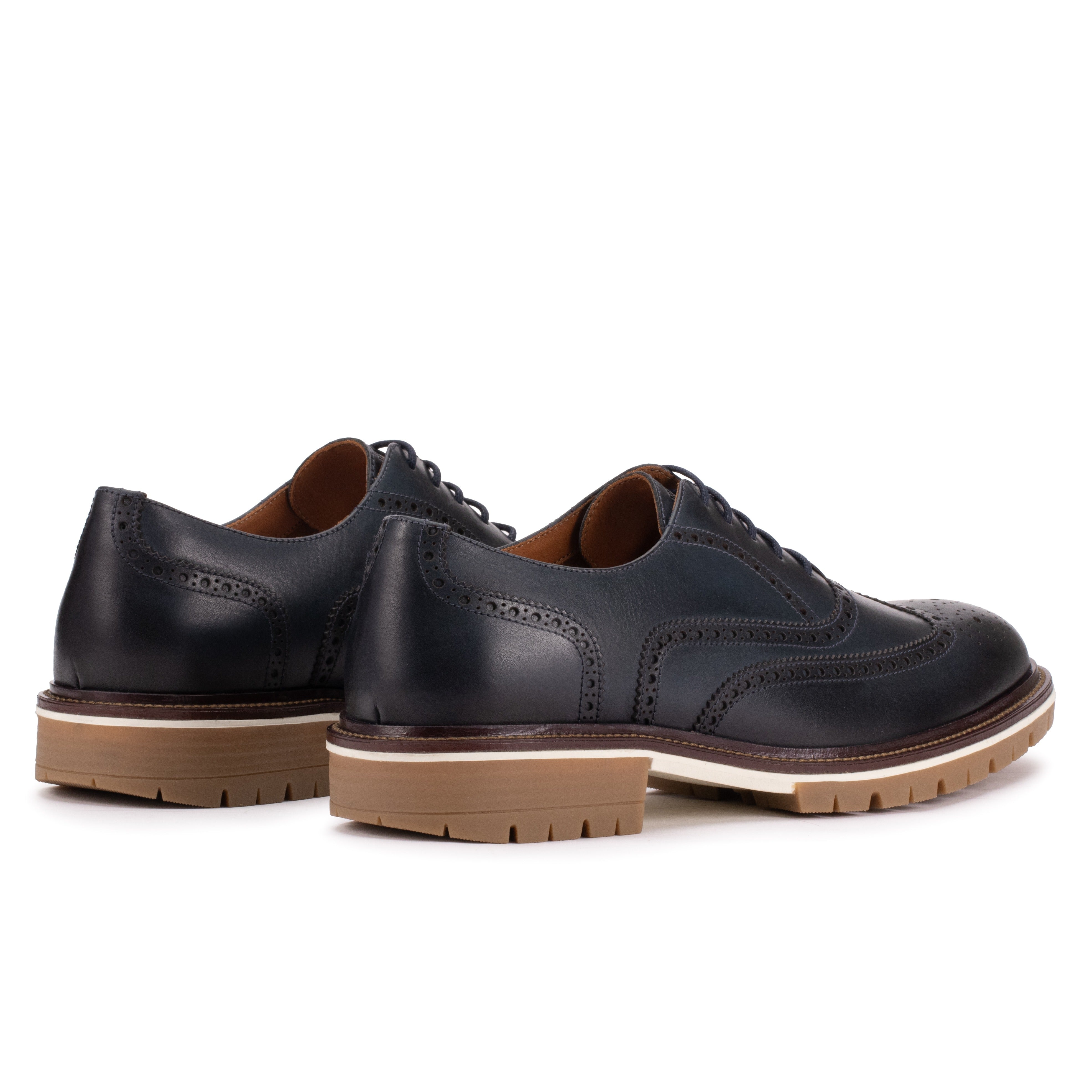 Rear angle of the Artelio Fifth Avenue gray leather wingtip derby showing the heel and wingtip profile