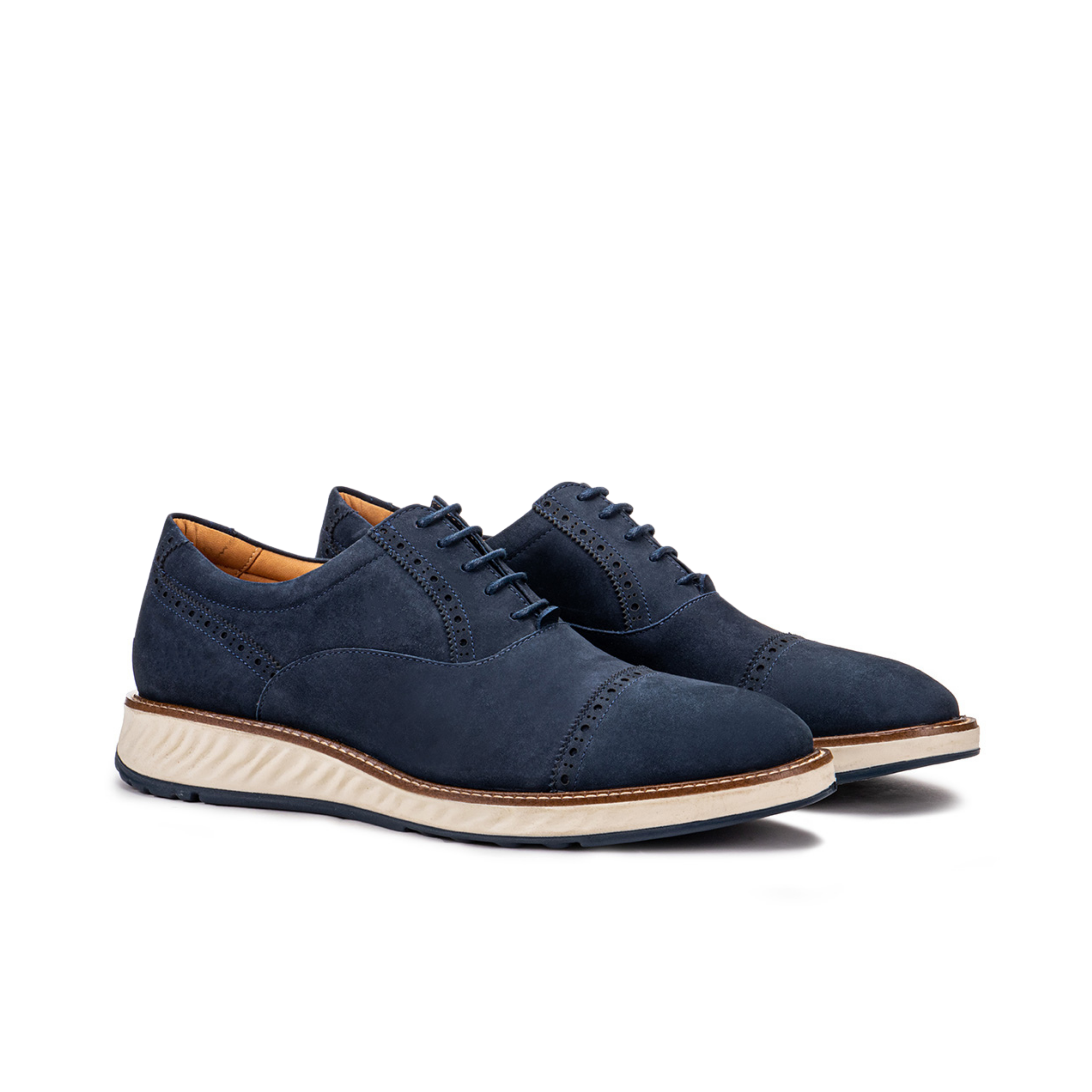 Front angle of the Artelio Greenville navy blue nubuck cap-toe oxford with white sole and leather lining