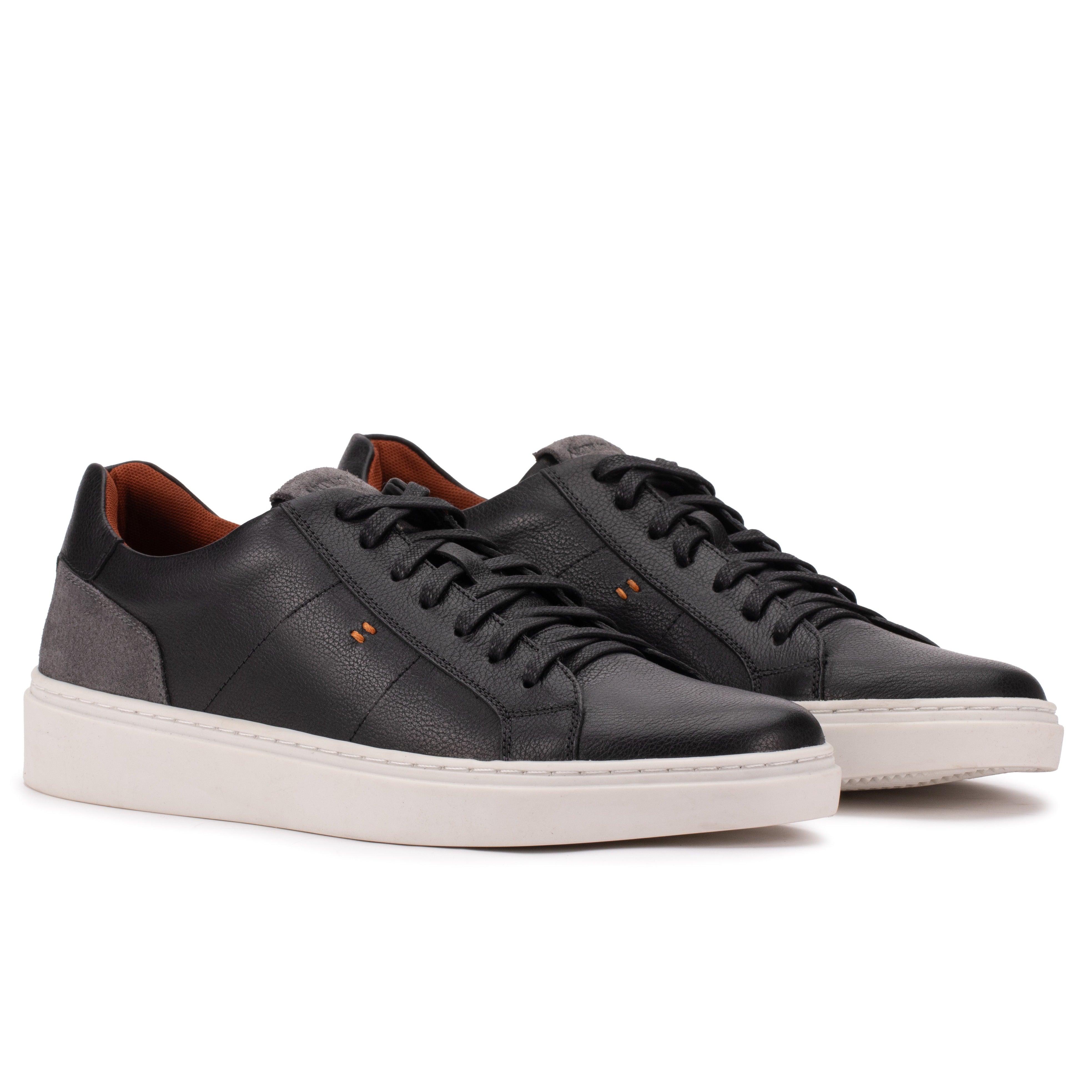 Front angle of the Artelio Heritage black and gray leather sneaker with lace-up styling and suede contrast