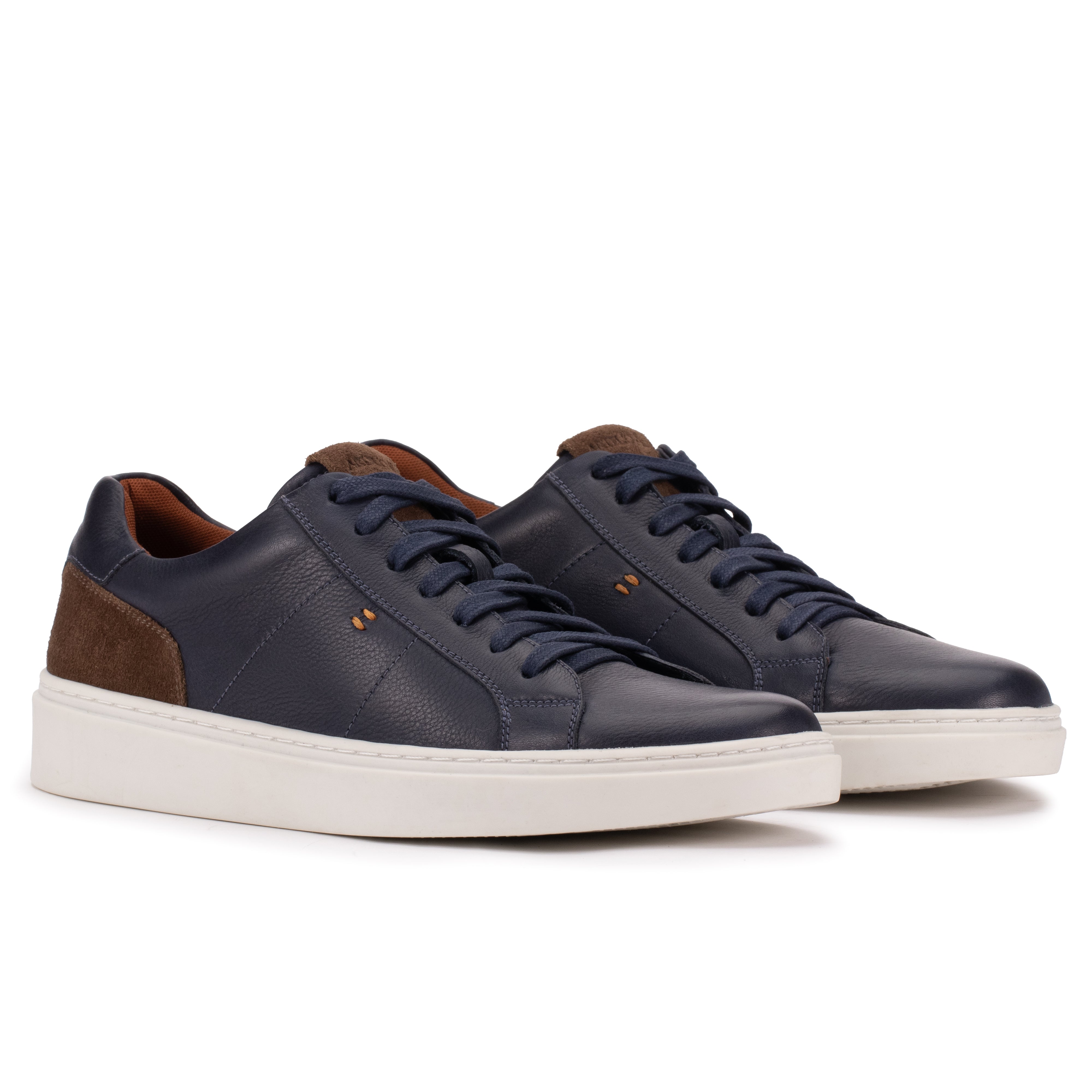 Front angle of the Artelio Heritage indigo and chocolate leather sneaker with lace-up styling and suede contrast
