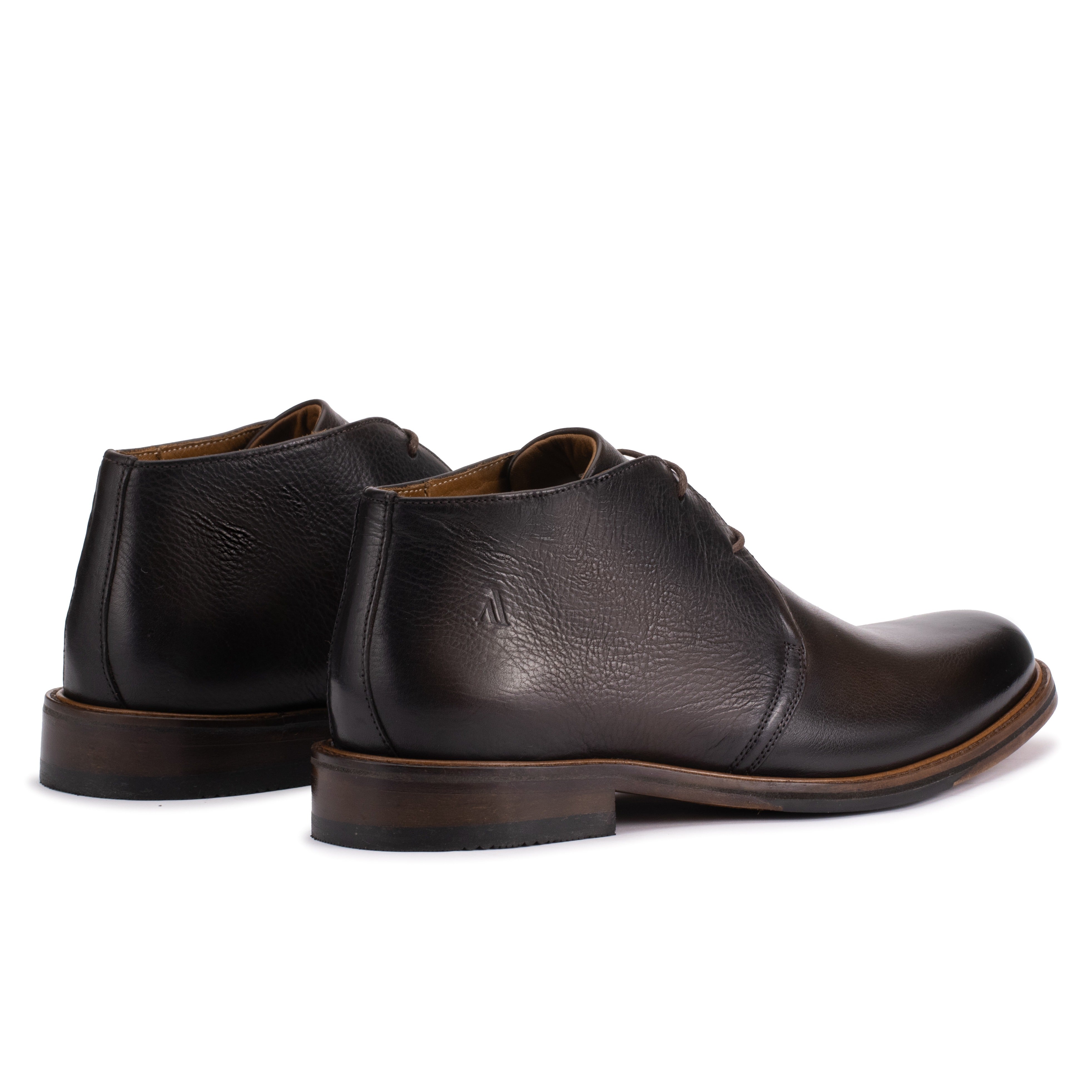 Rear angle of the Artelio New Siena rich brown leather chukka boot showing the compressed leather heel