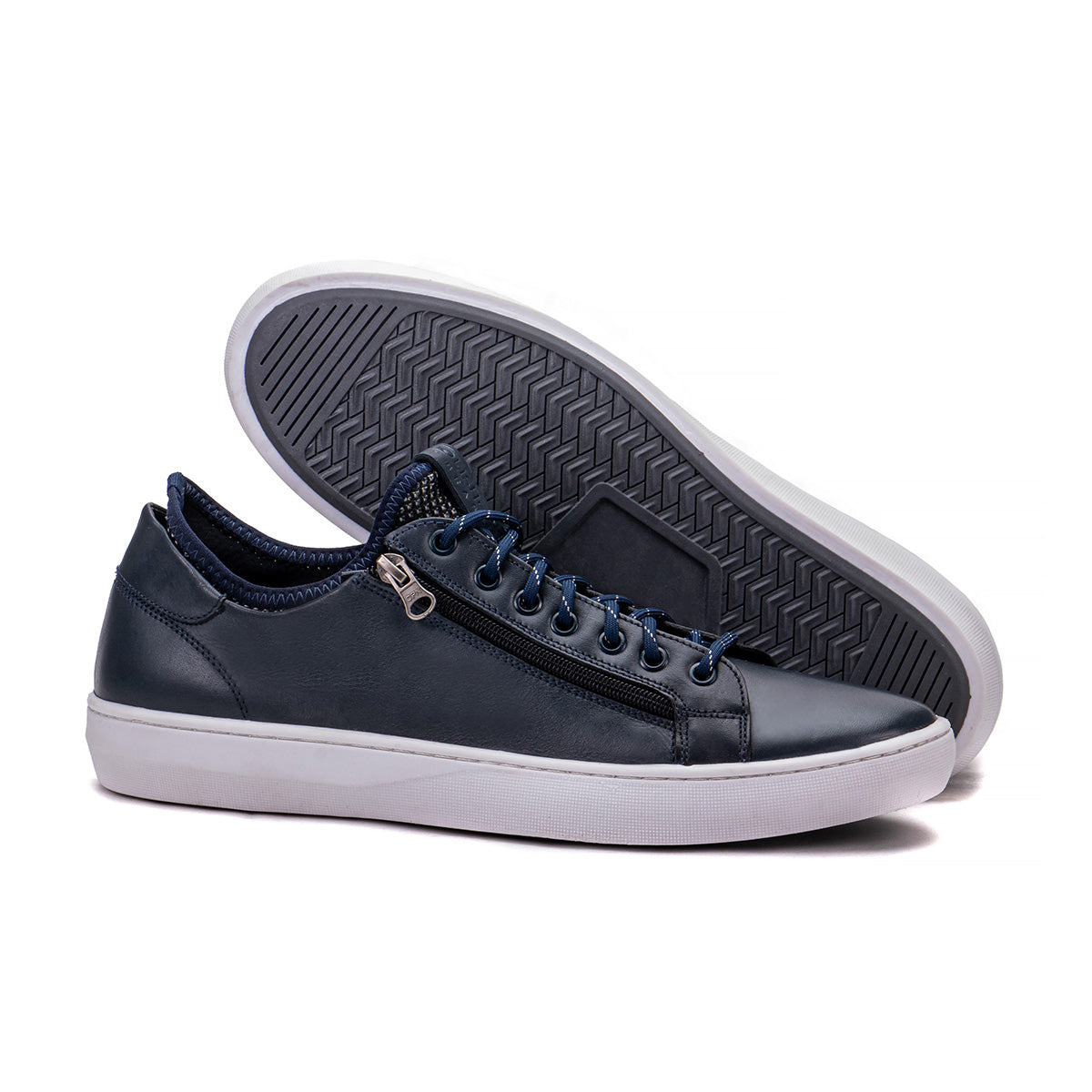Sole detail of the Artelio Pikes Peak navy leather side-zip sneaker showing the flexible everyday bottom