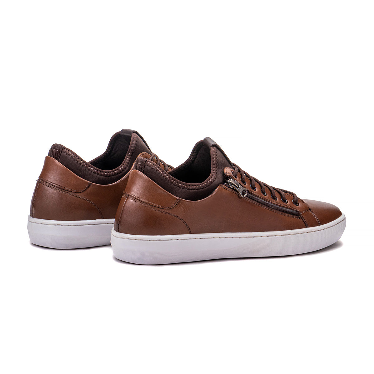Rear angle of the Artelio Pikes Peak tobacco leather side-zip sneaker showing the heel and low-top profile