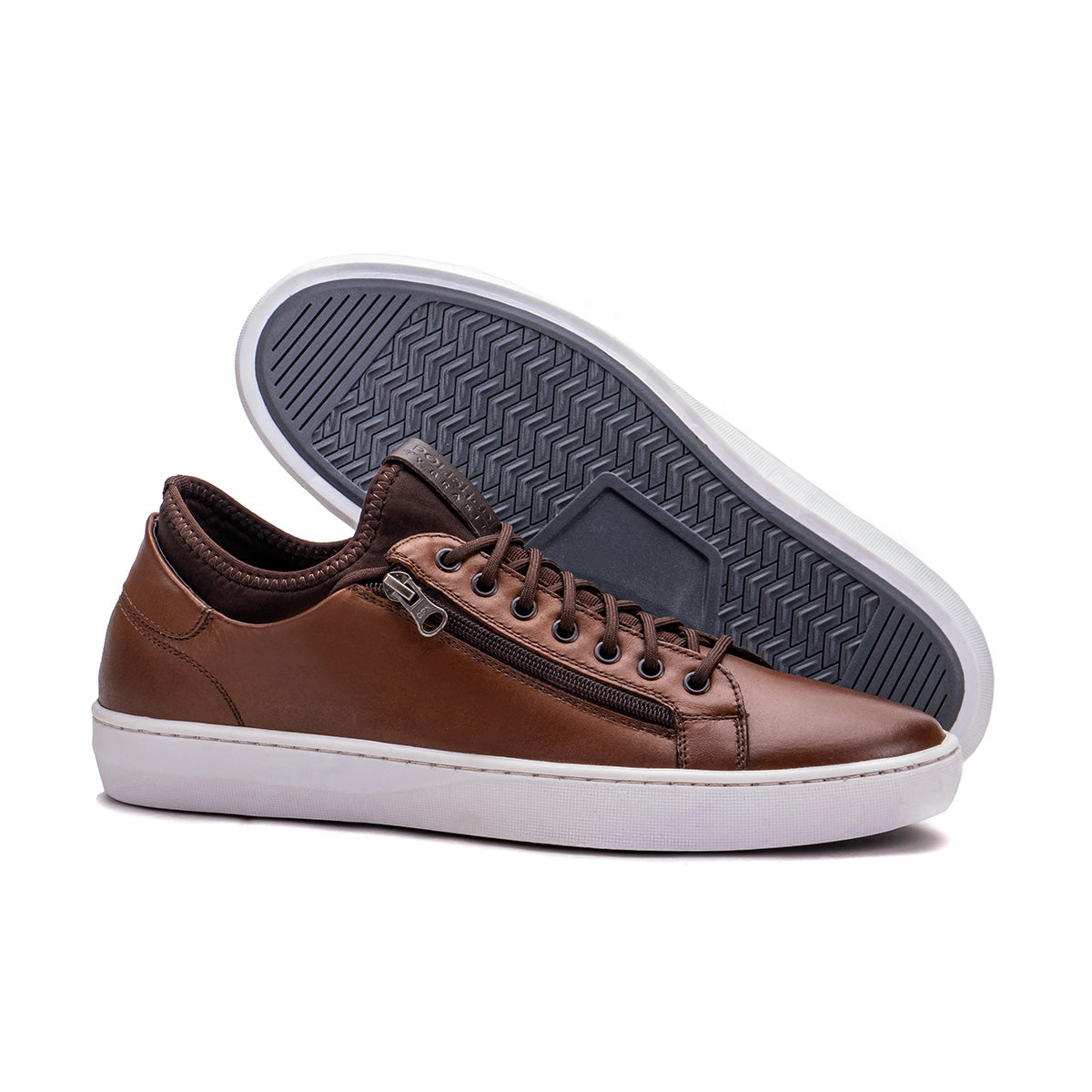 Sole detail of the Artelio Pikes Peak tobacco leather side-zip sneaker showing the flexible everyday bottom