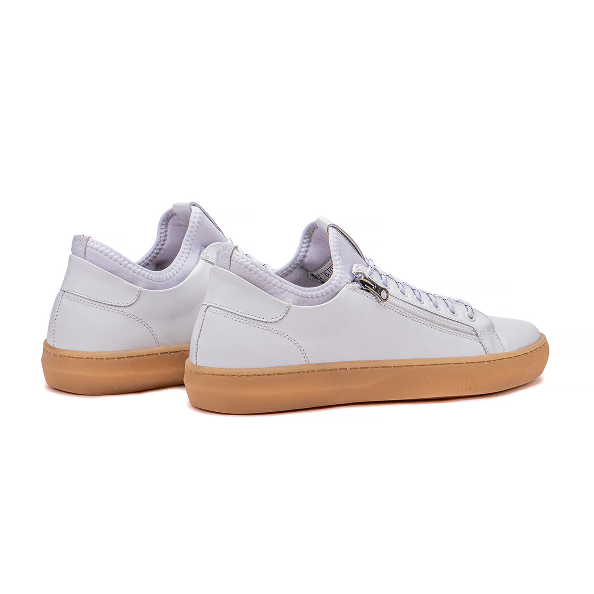 Rear angle of the Artelio Pikes Peak white leather side-zip sneaker showing the heel and low-top profile