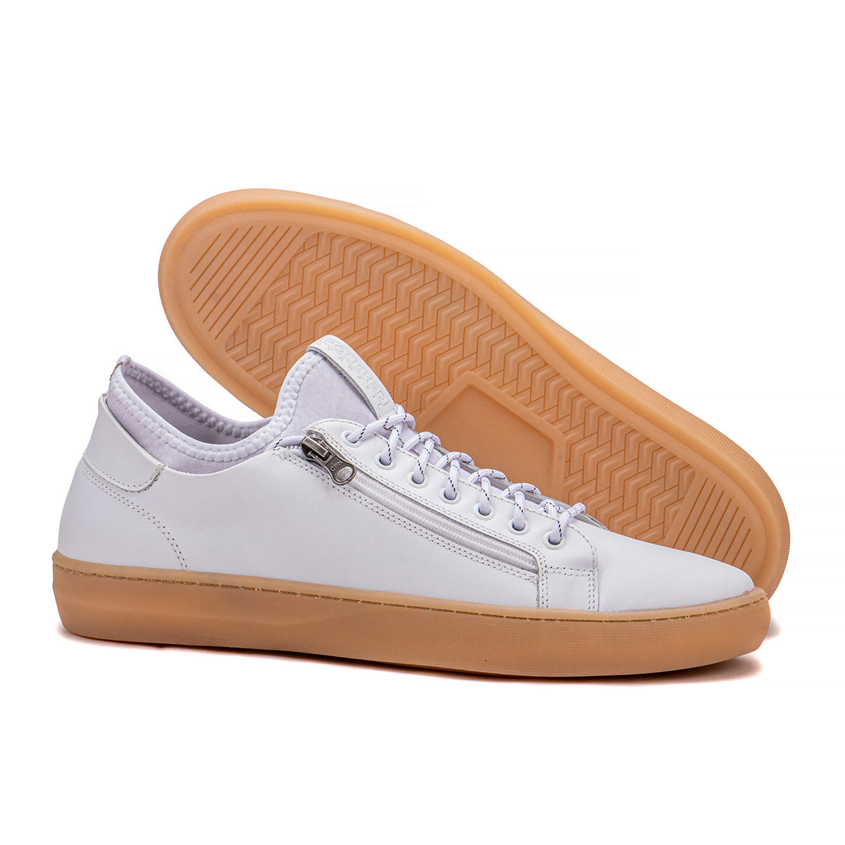 Sole detail of the Artelio Pikes Peak white leather side-zip sneaker showing the flexible everyday bottom