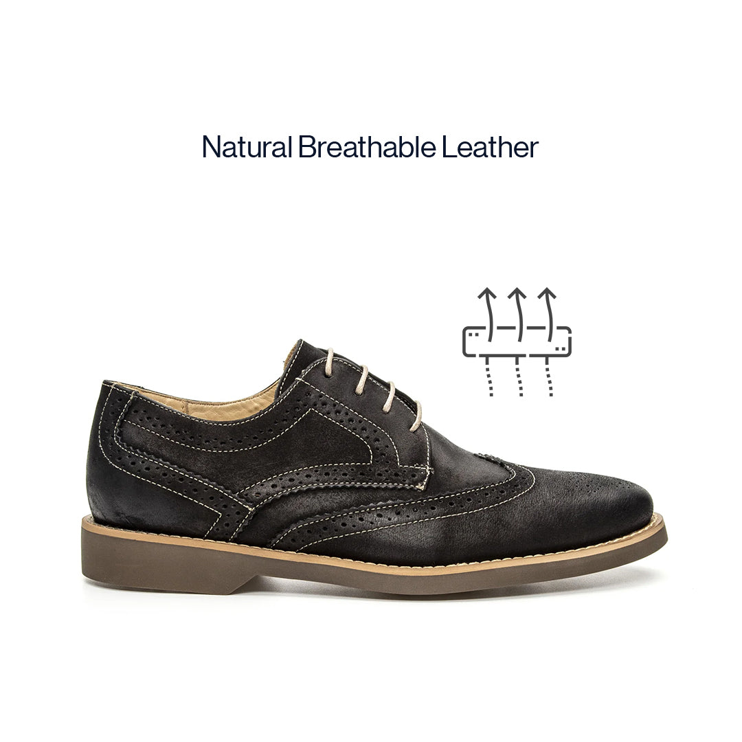 Lifestyle view of the Artelio Santiago midnight black leather wingtip derby styled for dress-casual wear