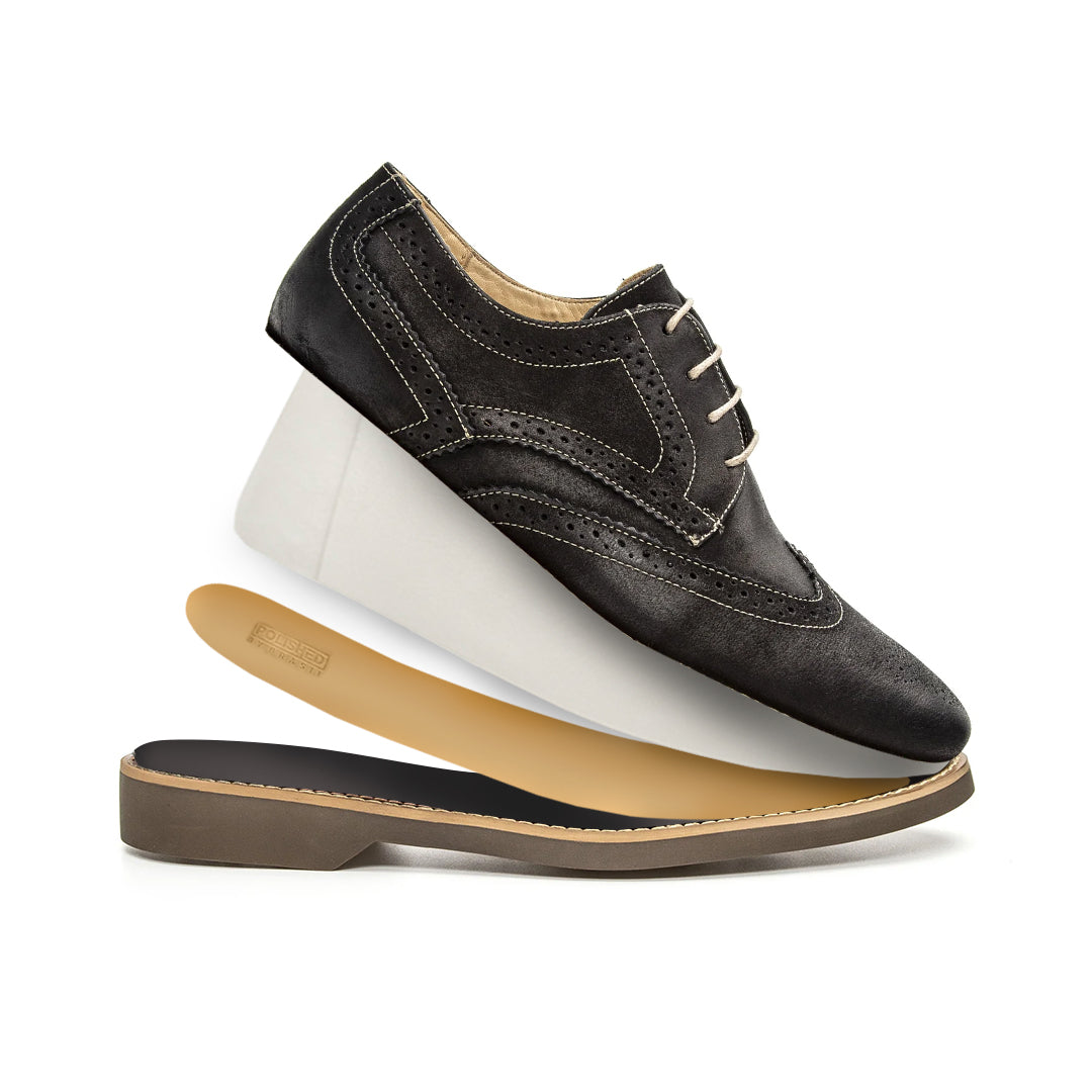 Lifestyle view of the Artelio Santiago midnight black leather wingtip derby styled for dress-casual wear