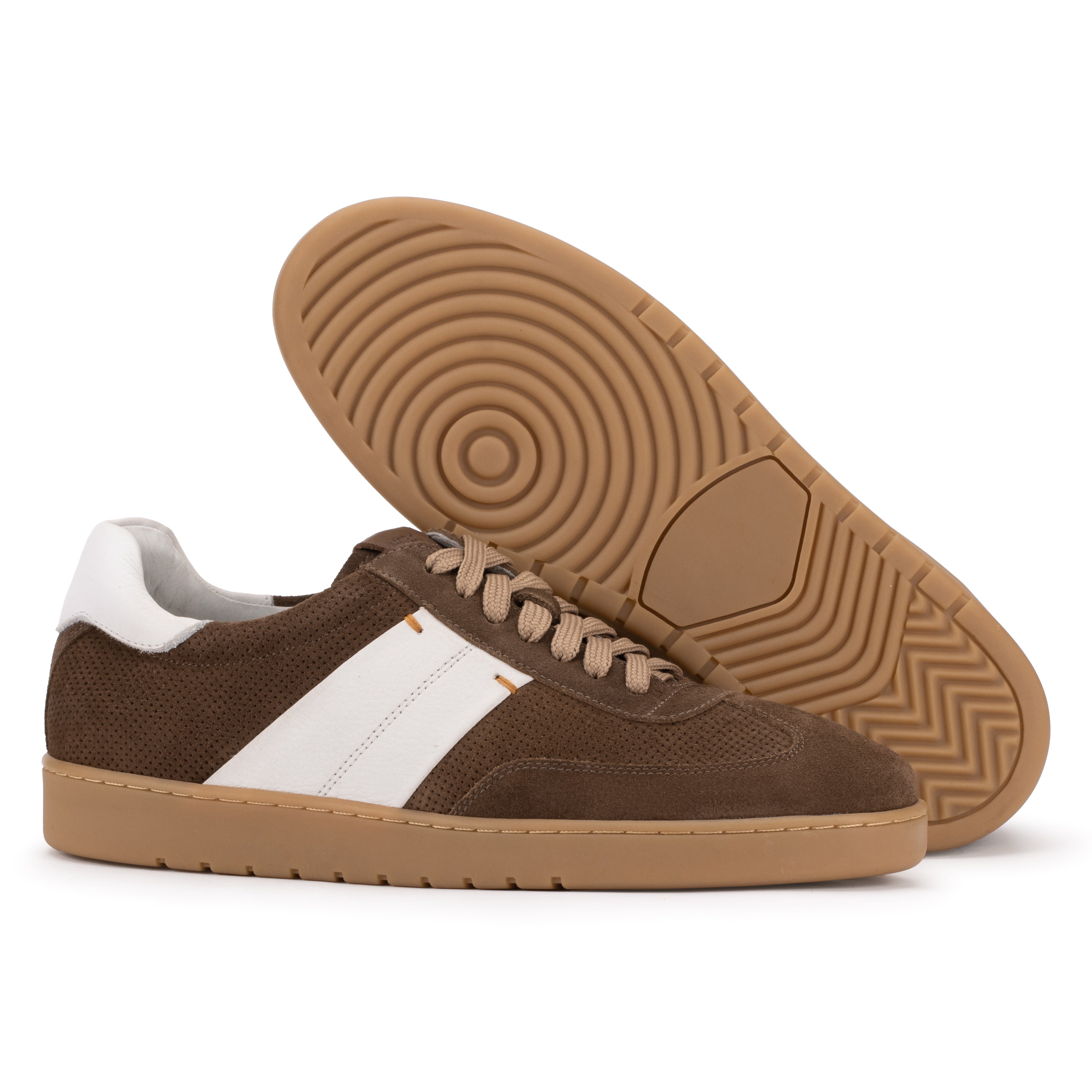 Sole detail of the Artelio Strata chocolate suede sneaker showing the grippy gum rubber tread