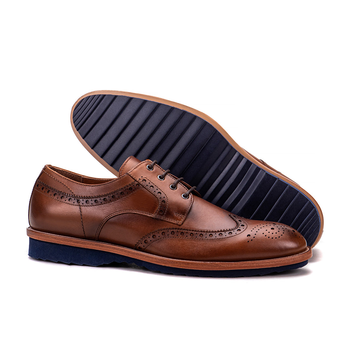 Sole detail of the Artelio Troia brown wingtip brogue dress shoe showing the hidden lightweight sole
