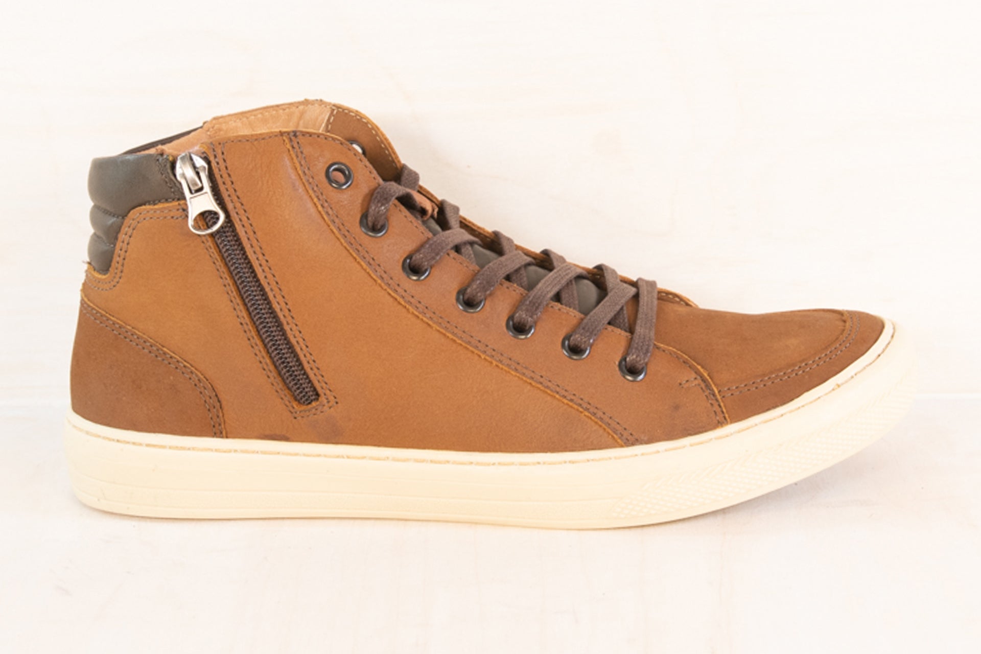 Side profile of the Artelio Campinas distressed cognac leather high-top sneaker boot showing the high-top leather upper