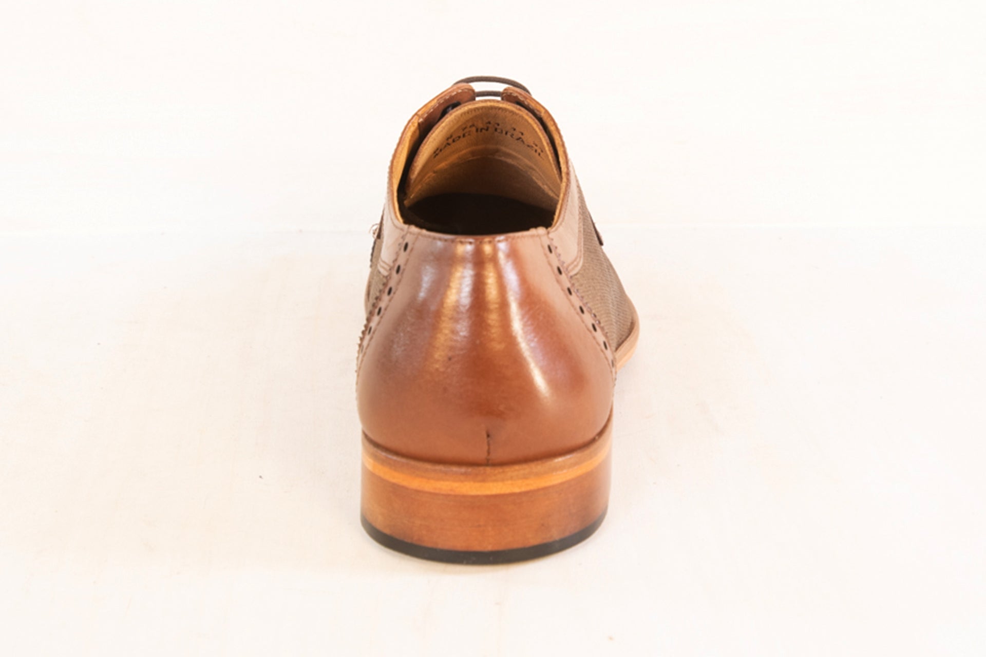 Rear angle of the Artelio Octavian honey leather sole dress shoe showing the heel and old-world dress profile
