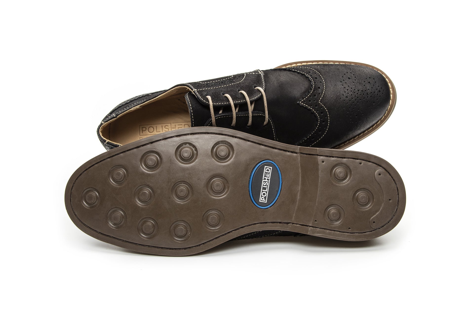 Lifestyle view of the Artelio Santiago midnight black leather wingtip derby styled for dress-casual wear